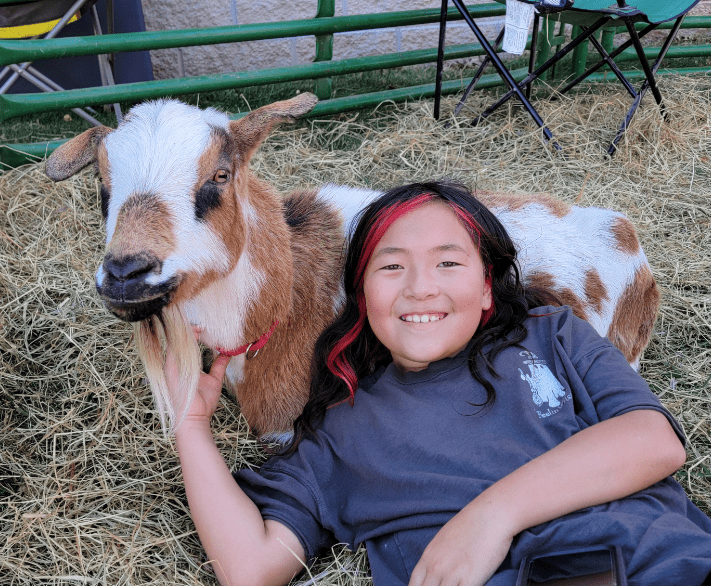 last chance ranch volunteer with a goat